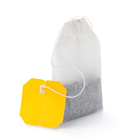 Teabag with yellow label. Isolated on white backgroundの写真素材