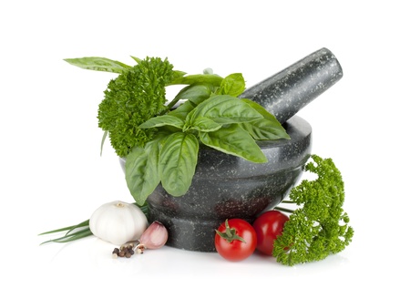 Fresh herbs and spices in mortar  Isolated on white backgroundの写真素材
