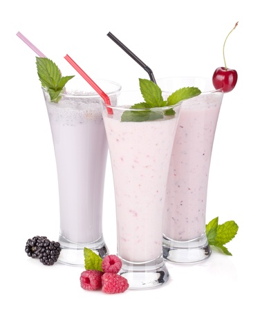 Blackberry, raspberry and cherry milk smoothie with mint. Isolated on white backgroundの写真素材