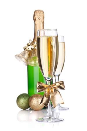 Champagne bottle, glasses and christmas decor. Small DOF. Isolated on white backgroundの写真素材