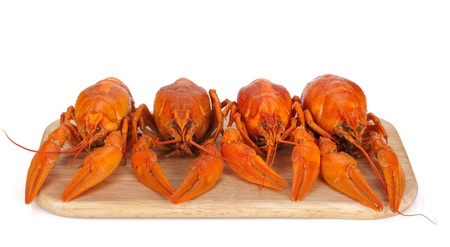 Boiled crayfishes on cutting board. Isolated on white backgroundの写真素材