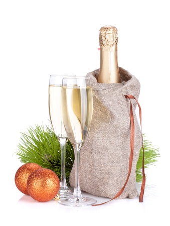 Champagne and christmas baubles. Isolated on white backgroundの写真素材