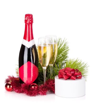 Champagne, christmas decor and gift. Isolated on white backgroundの写真素材
