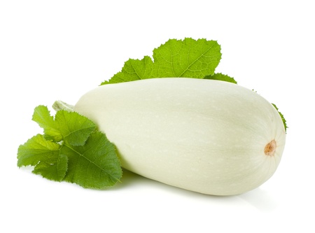 Fresh zucchini fruit with green leaves. Isolated on white backgroundの写真素材