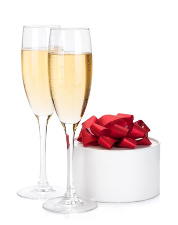 Champagne glasses and gift  Isolated on white backgroundの写真素材