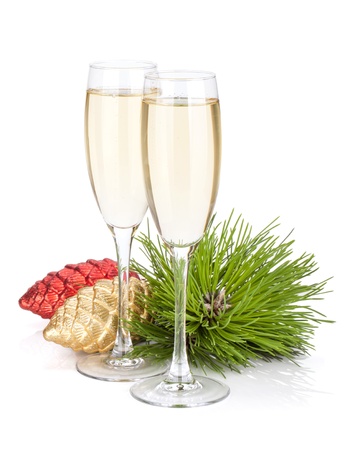 Champagne glasses, firtree and christmas decor. Isolated on white backgroundの写真素材