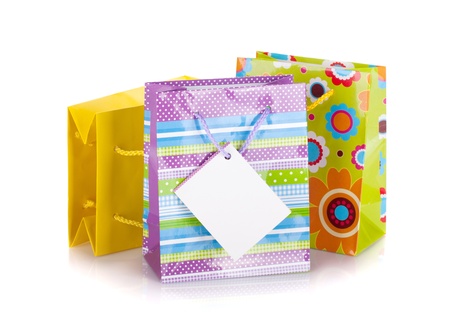 Colored gift bags. Isolated on white backgroundの写真素材
