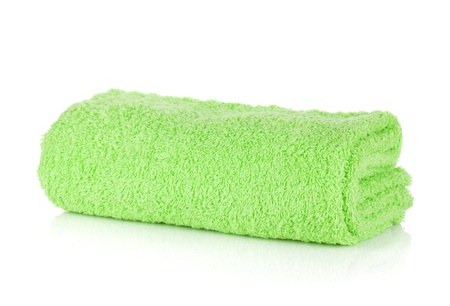 Green bath towel. Isolated on white backgroundの写真素材