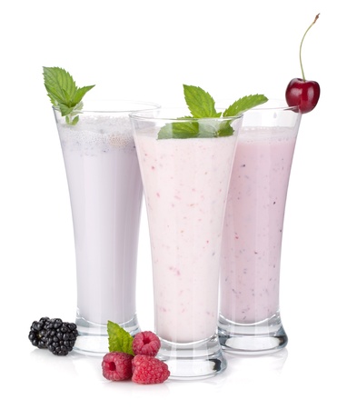 Blackberry, raspberry and cherry milk smoothie with mint. Isolated on white backgroundの写真素材