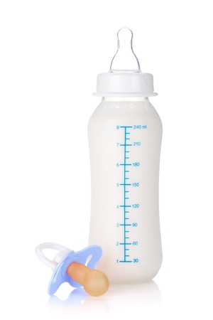Baby bottle with milk and pacifier for boy. Isolated on white backgroundの写真素材