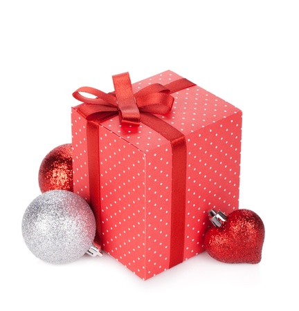 Gift box with ribbon and bow and christmas decor. Isolated on white backgroundの写真素材