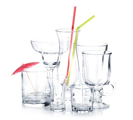 Cocktail glasses with drinking straws and umbrella. Isolated on white backgroundの写真素材