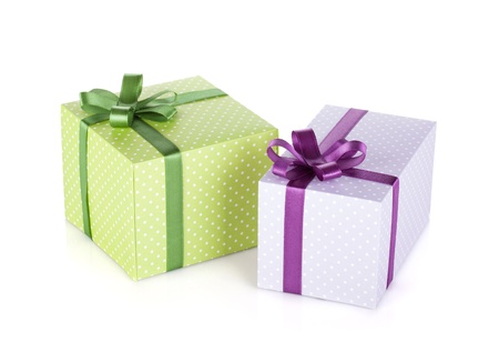 Two colorful gift boxes with ribbon and bow. Isolated on white backgroundの写真素材