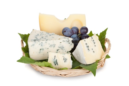 Various types of cheeses and grape. Isolated on a white background.の写真素材