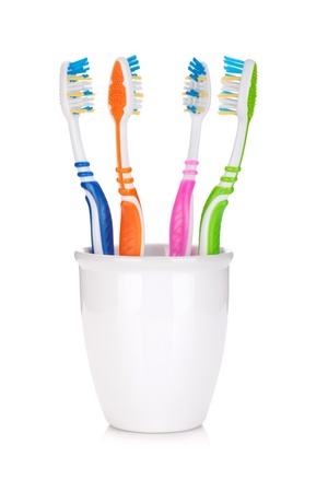 Four colorful toothbrushes. Isolated on white backgroundの写真素材