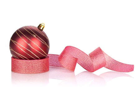 Red sparkling christmas bauble with ribbon. Isolated on white backgroundの写真素材