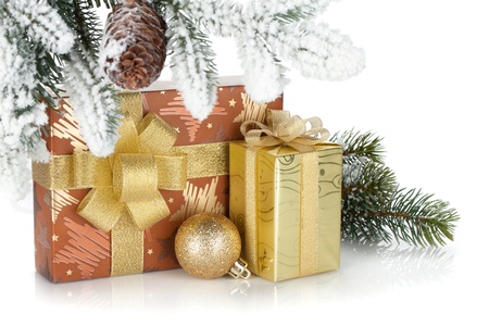 Gift box and christmas decor under snowy fir tree  Isolated on white backgroundの写真素材