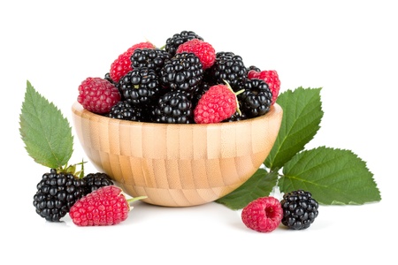 Blackberry and raspberry in wooden bowl  Isolated on white background