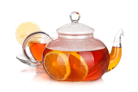 Glass teapot and cup of black tea with lemon. Isolated on white backgroundの写真素材