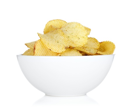 Potato chips in bowl. Isolated on white backgroundの写真素材