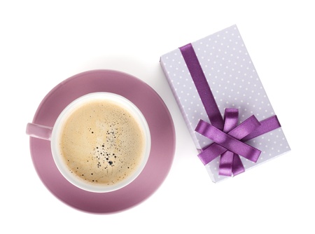 Violet coffee cup and gift box with bow. View from above. Isolated on white backgroundの写真素材