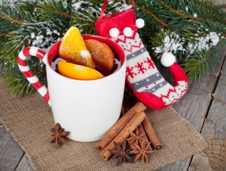 Christmas mulled wine with fir tree on wooden tableの写真素材