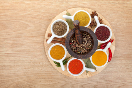 Various spices selection on wooden tableの写真素材