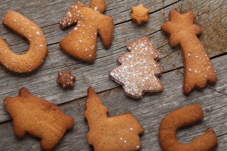 Various gingerbread cookies on wooden table background