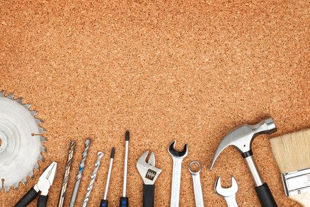 Set of tools on cork panel background with copy spaceの写真素材
