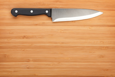 Kitchen knife on cutting board with copy space
