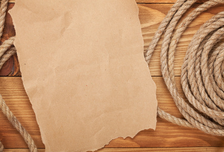 Old paper for copy space and rope on wooden textured の写真素材