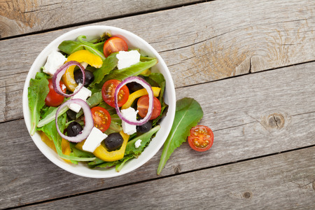 Fresh healthy salad on wooden table. の写真素材