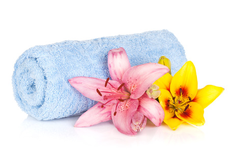 Spa setting with colorful lily flowers. Isolated on white backgroundの写真素材