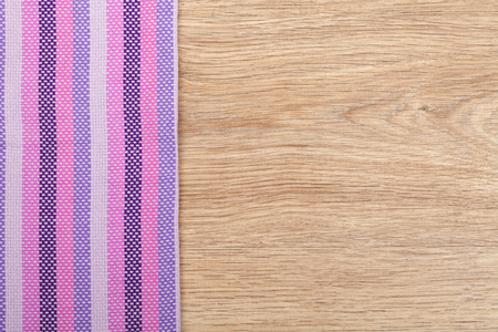 Kitchen towel on wooden table with copy spaceの写真素材