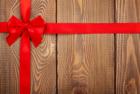 Valentines day background with red ribbon over woodの写真素材