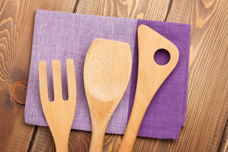 Wood kitchen utensils over wooden table backgroundの写真素材