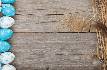 Easter eggs on wooden table background with copy spaceの写真素材