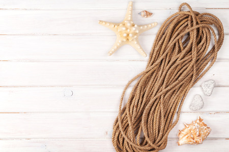 Summer time sea vacation background with star fish and marine ropeの写真素材