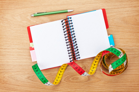 Tape measure and notepad for copy space. Fitness and healthの写真素材