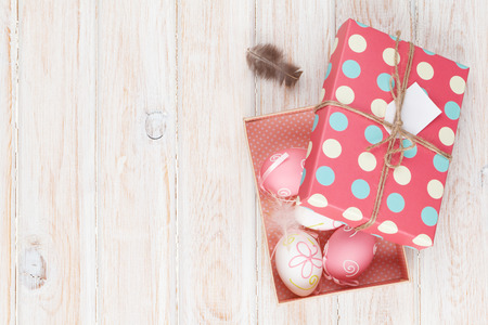 Easter eggs in gift box. Top view with copy space