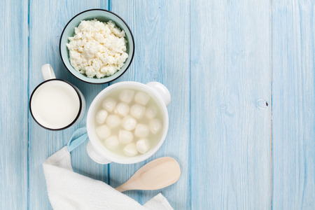 Dairy products on wooden table. Milk, cheese and curd. Top view with copy spaceの写真素材