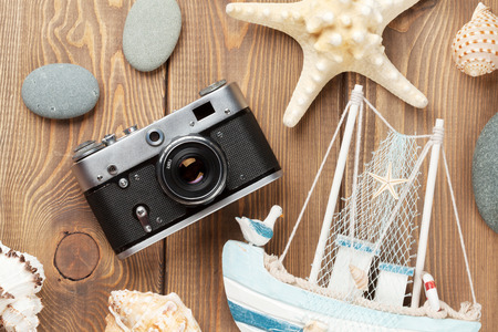 Travel and vacation items on wooden table. Top viewの写真素材