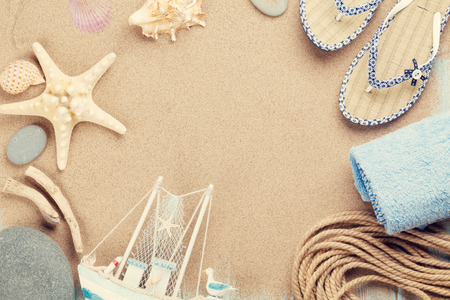 Travel and vacation items on sea sand. の写真素材
