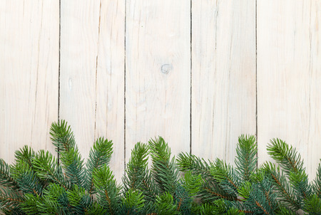 Christmas wooden background with fir tree and copy spaceの写真素材