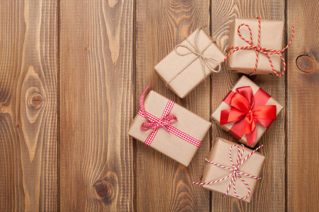 Gift boxes on wooden table background with copy space