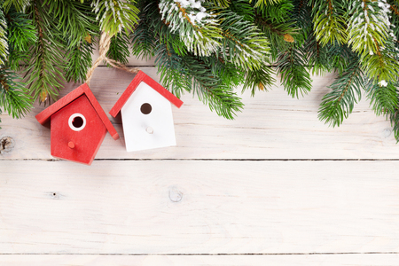 Christmas wooden background with snow fir tree and decor. View with copy spaceの写真素材