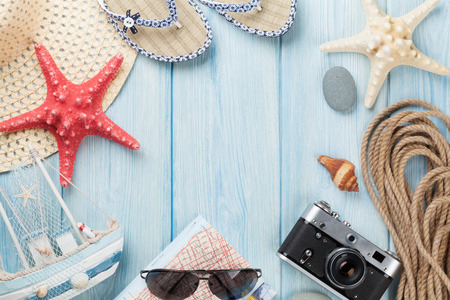 Travel and vacation items on wooden table. Top view with copy spaceの写真素材