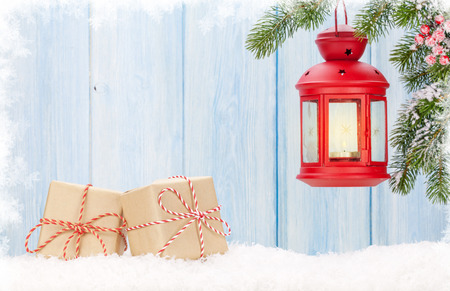 Christmas candle lantern, gift boxes and fir tree. View with copy spaceの写真素材