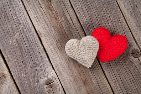 Handmaded Valentines day hearts on wooden table. Top view with copy spaceの写真素材