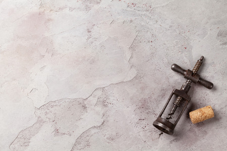 Vintage corkscrew on stone table. Top view with copy spaceの写真素材